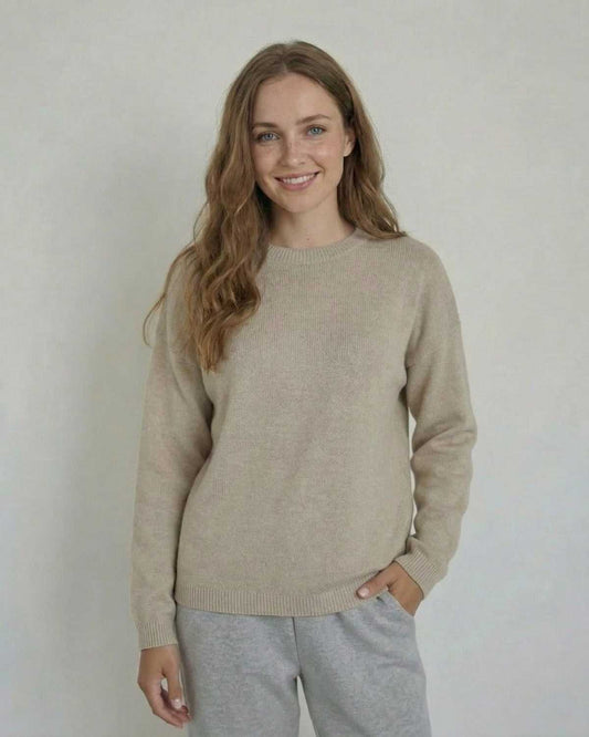 Woman wearing the Siena Pullover by SLIMONA, a soft wool knit sweater with a relaxed fit and round neck.