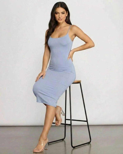 Model wearing Sienna Midi Dress by SLIMONA, showcasing its elegant fit and sleek knit design.