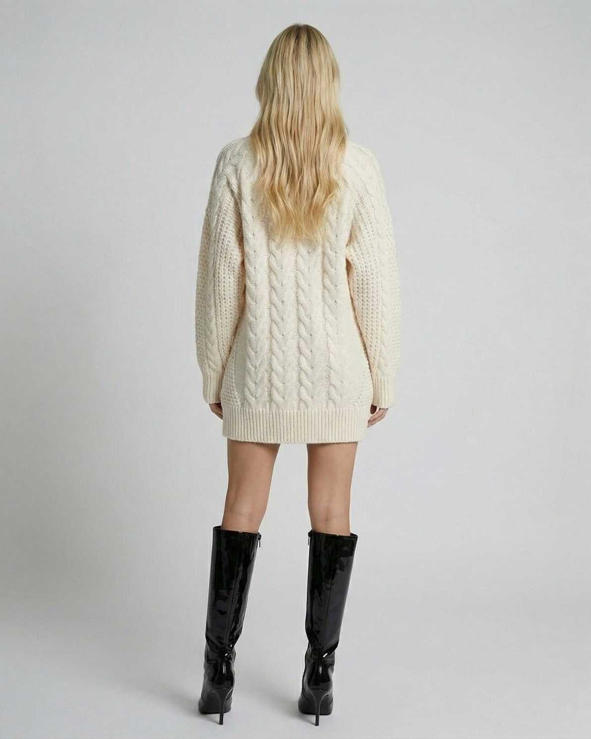 Back view of the Sienna Mini Dress by Lauven, showcasing cable knit texture and modern silhouette.