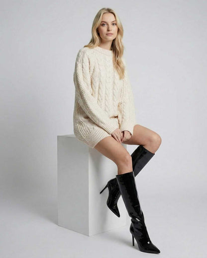Sienna Mini Dress by Lauven, featuring a cozy cable knit design and stylish boots, perfect for seasonal styling.