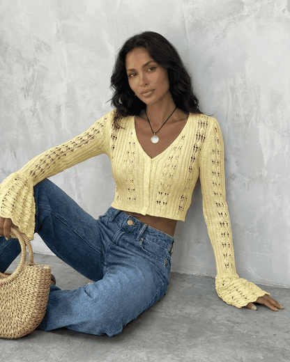 Solana Cardigan by SLIMONA in yellow, cropped cotton knit, featuring flare sleeves and a flattering V-neckline.