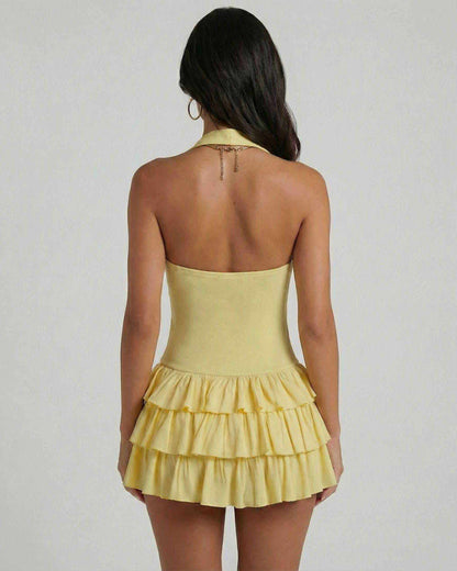 Back view of Solara Mini Dress by SLIMONA, featuring yellow tiered skirt and square neckline.