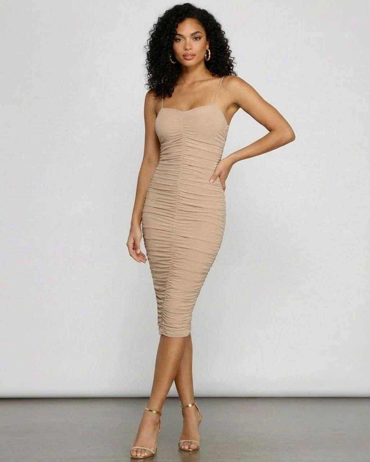 Solenne Midi Dress by SLIMONA featuring sweetheart neckline and ruched bodycon silhouette.