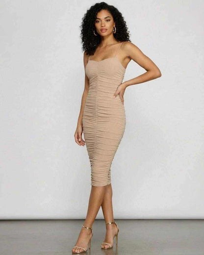 Elegant woman wearing SLIMONA Solenne Midi Dress with sweetheart neckline and ruched bodycon silhouette.