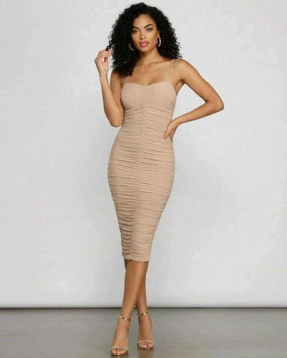 Solenne Midi Dress by SLIMONA, featuring a ruched bodycon silhouette and sweetheart neckline for elegant evening wear.