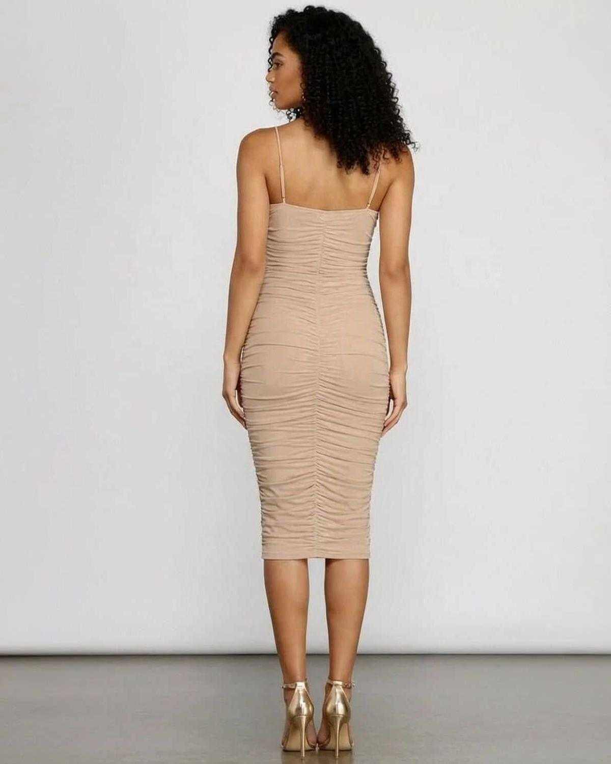 Back view of Solenne Midi Dress by SLIMONA featuring a ruched bodycon silhouette.