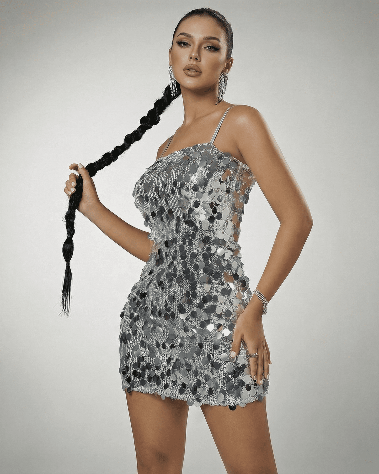 Stella Mini Dress by SLIMONA - Silver sequin off-the-shoulder mini dress with high waist, showcasing a modern silhouette.
