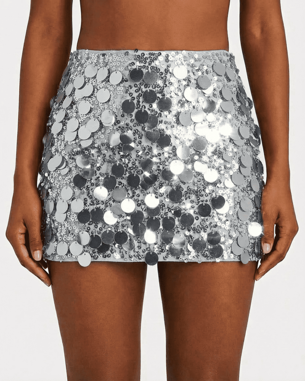 Sterling Mini Skirt by SLIMONA with silver sequin finish, perfect for glamorous night-out styling.