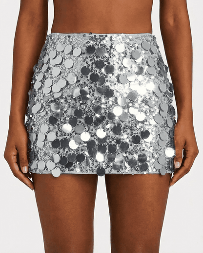 Sterling Mini Skirt by SLIMONA with silver sequin finish, perfect for glamorous night-out styling.