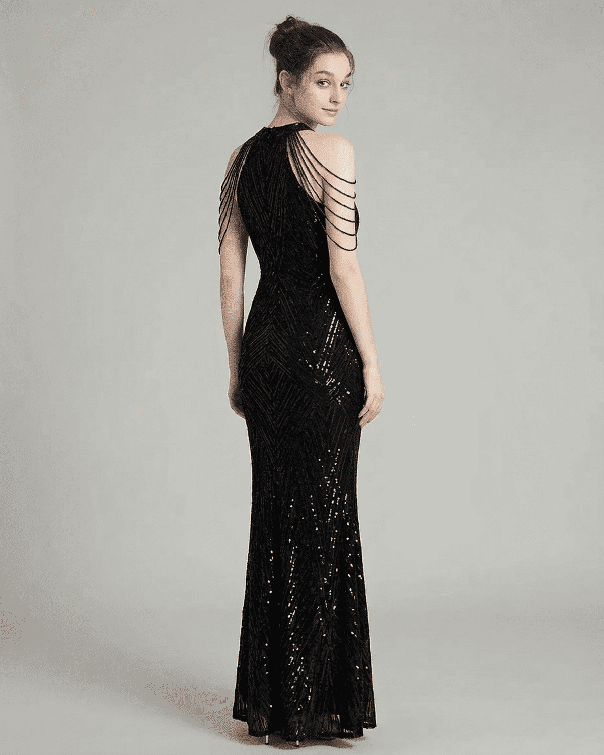 Vega Maxi Dress by SLIMONA featuring a stunning back view with sequins and shoulder detailing.