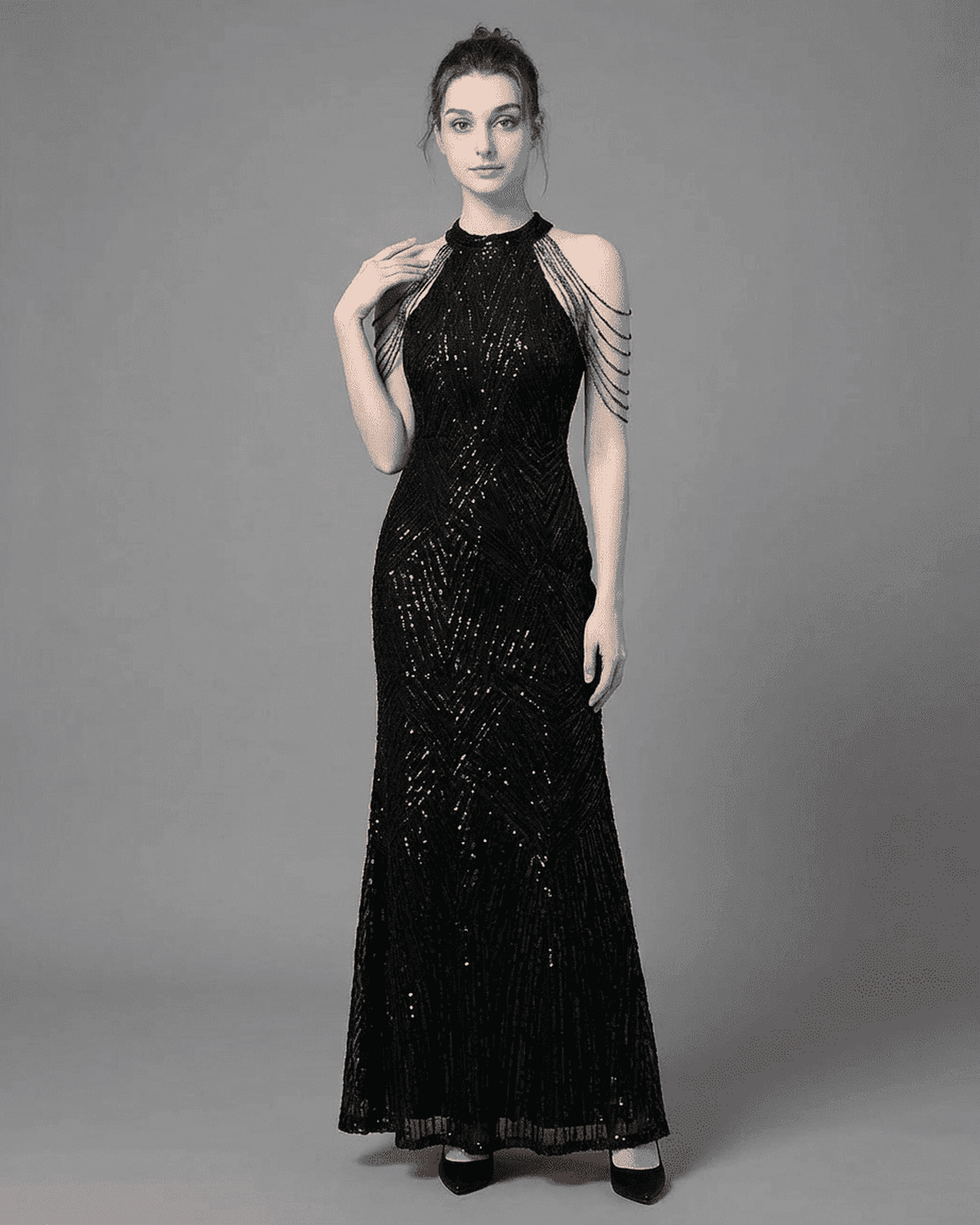 Vega Maxi Dress by SLIMONA showing a black sequined halter mermaid gown with elegant shoulder embellishments.