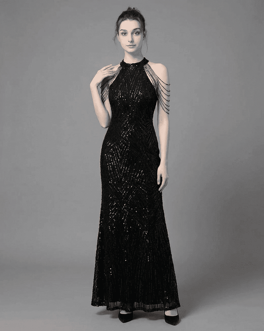 Vega Maxi Dress by SLIMONA showing a black sequined halter mermaid gown with elegant shoulder embellishments.