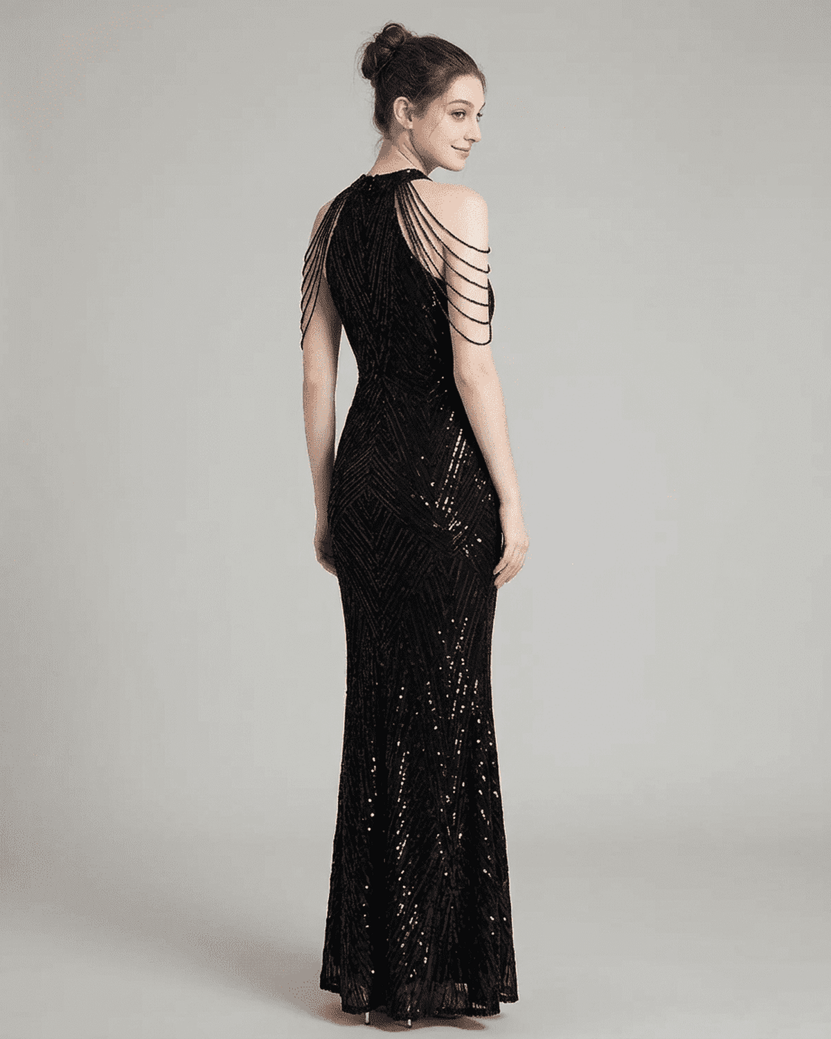 Vega Maxi Dress by SLIMONA, elegant black halter mermaid gown with intricate sequin detailing, showcasing a graceful silhouette.