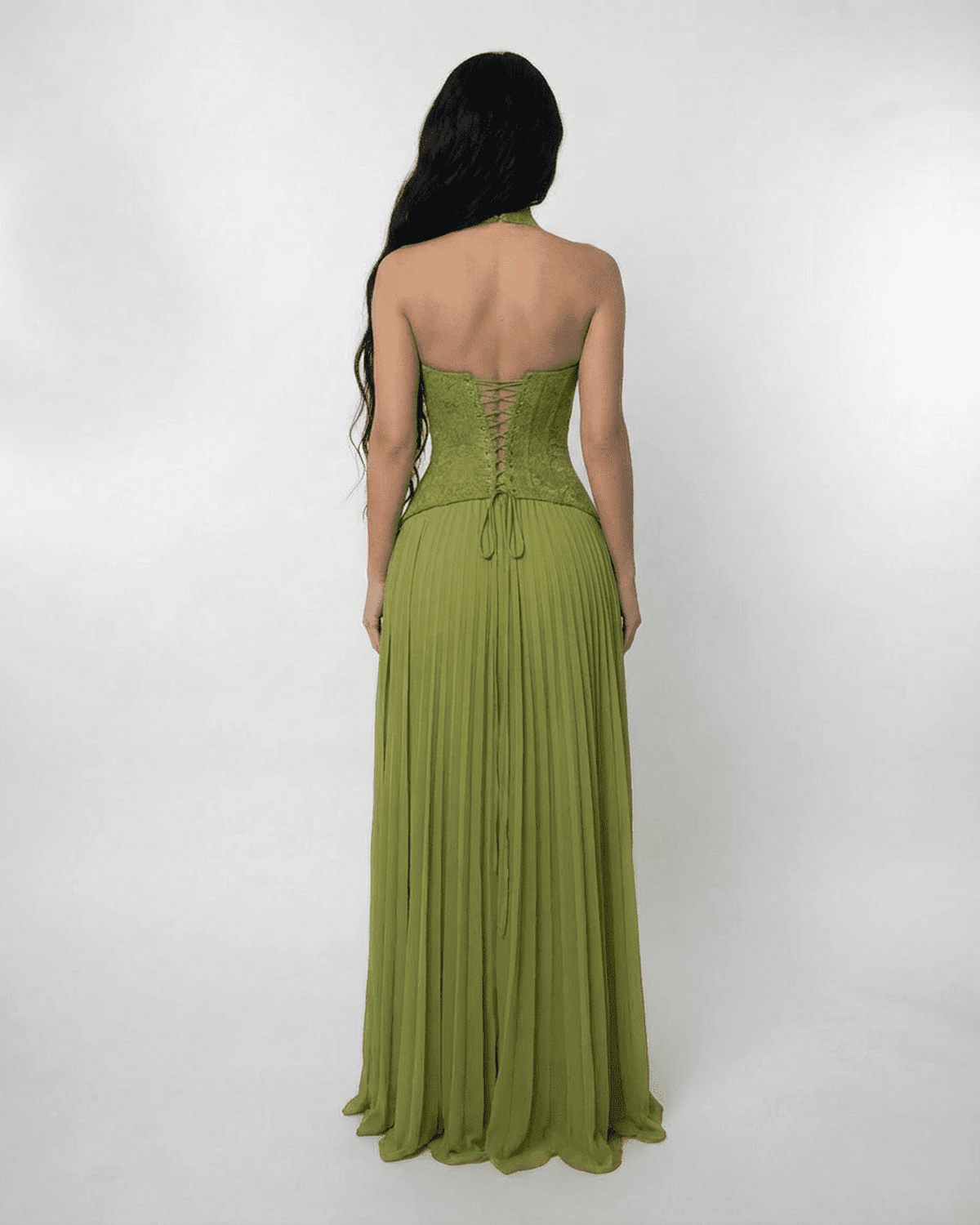 Back view of the SLIMONA Verdant Maxi Dress featuring a lace bodice and pleated skirt in olive green.