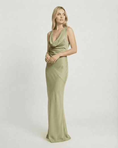 Verdant Maxi Dress by SLIMONA, showcasing a sleek satin-effect cowl neck design in soft green tones.