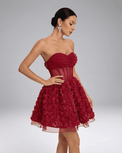 Verona Mini Dress by SLIMONA, a red strapless puff mini adorned with 3D floral texture and beaded details.