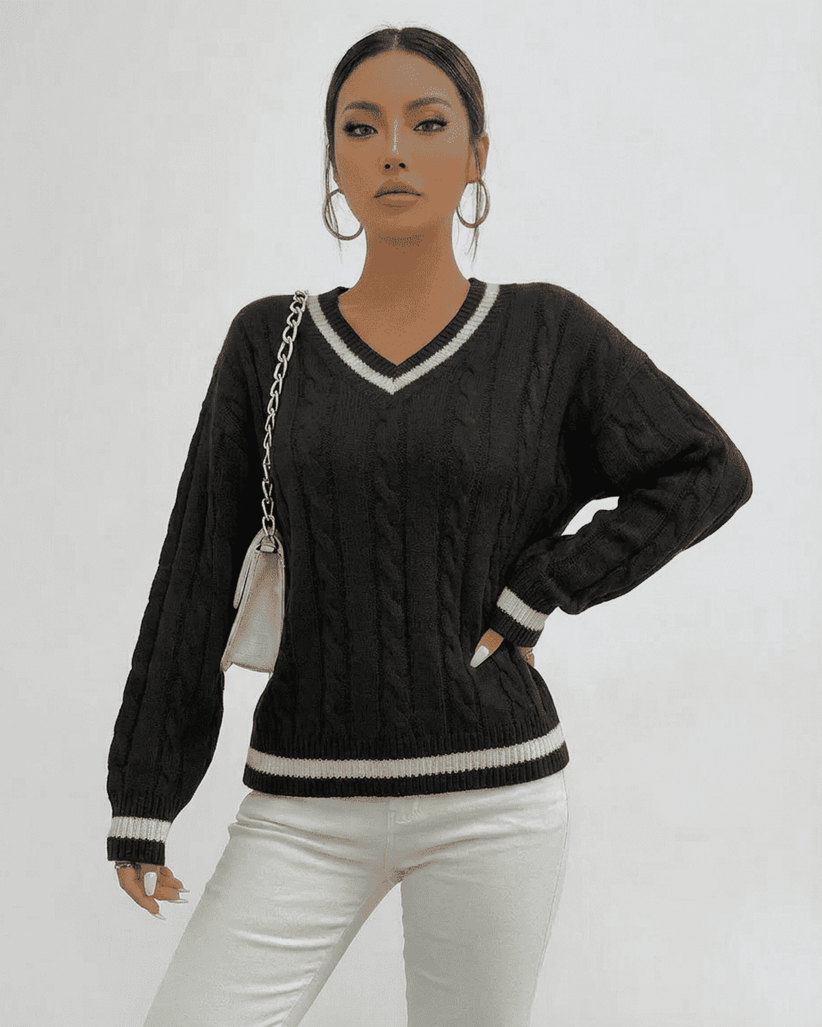 Verona Sweater by SLIMONA featuring cable knit texture and V-neck design, perfect for stylish layering.