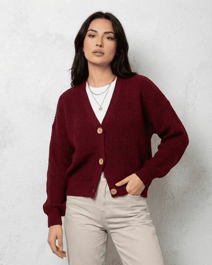 Vesper Cardigan by SLIMONA in luxurious burgundy with classic V-neck design, offering comfort and sophistication.