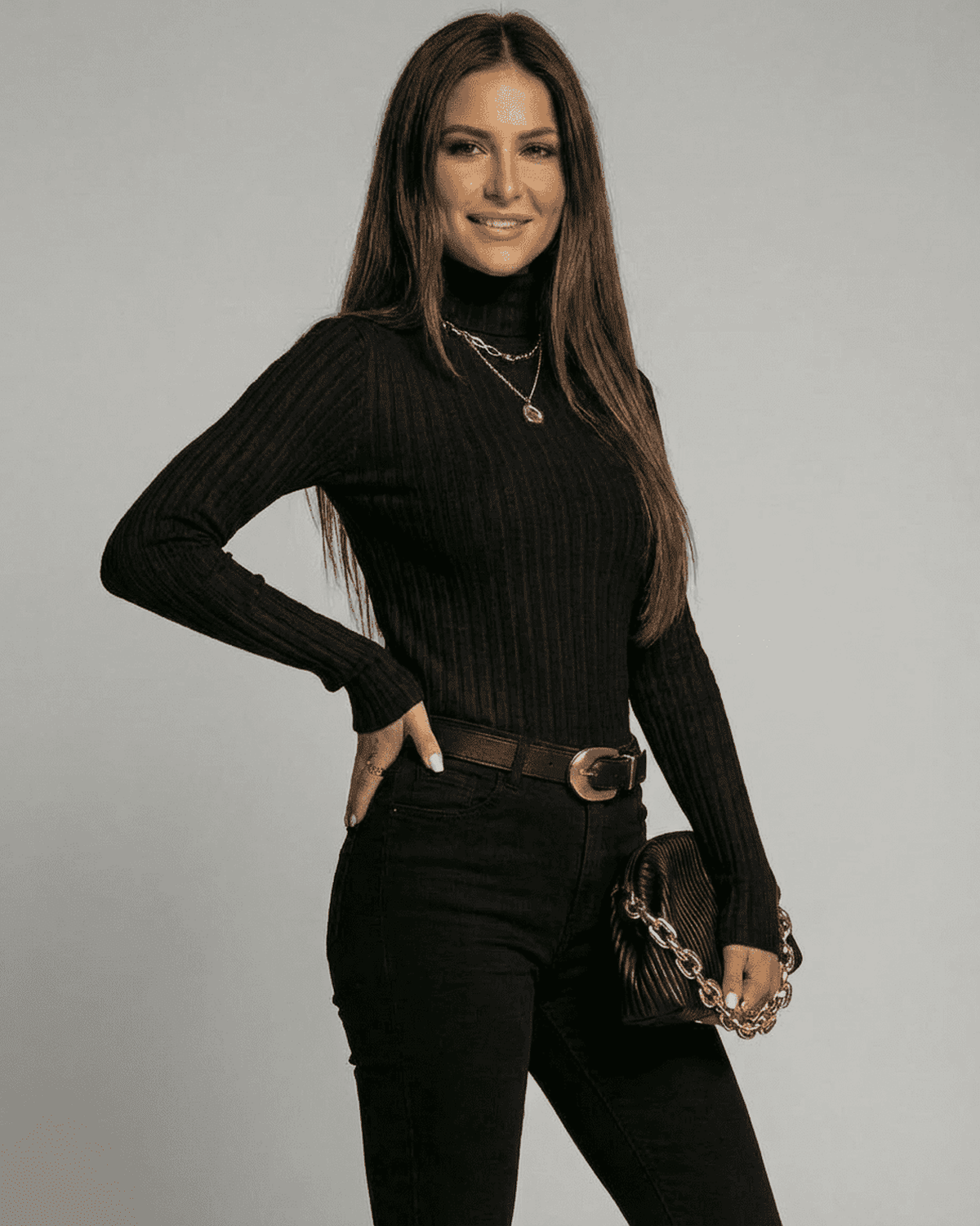 Vesper Sweater - Slimona ribbed turtleneck knitwear model in black, showcasing slim fit and elegant style.