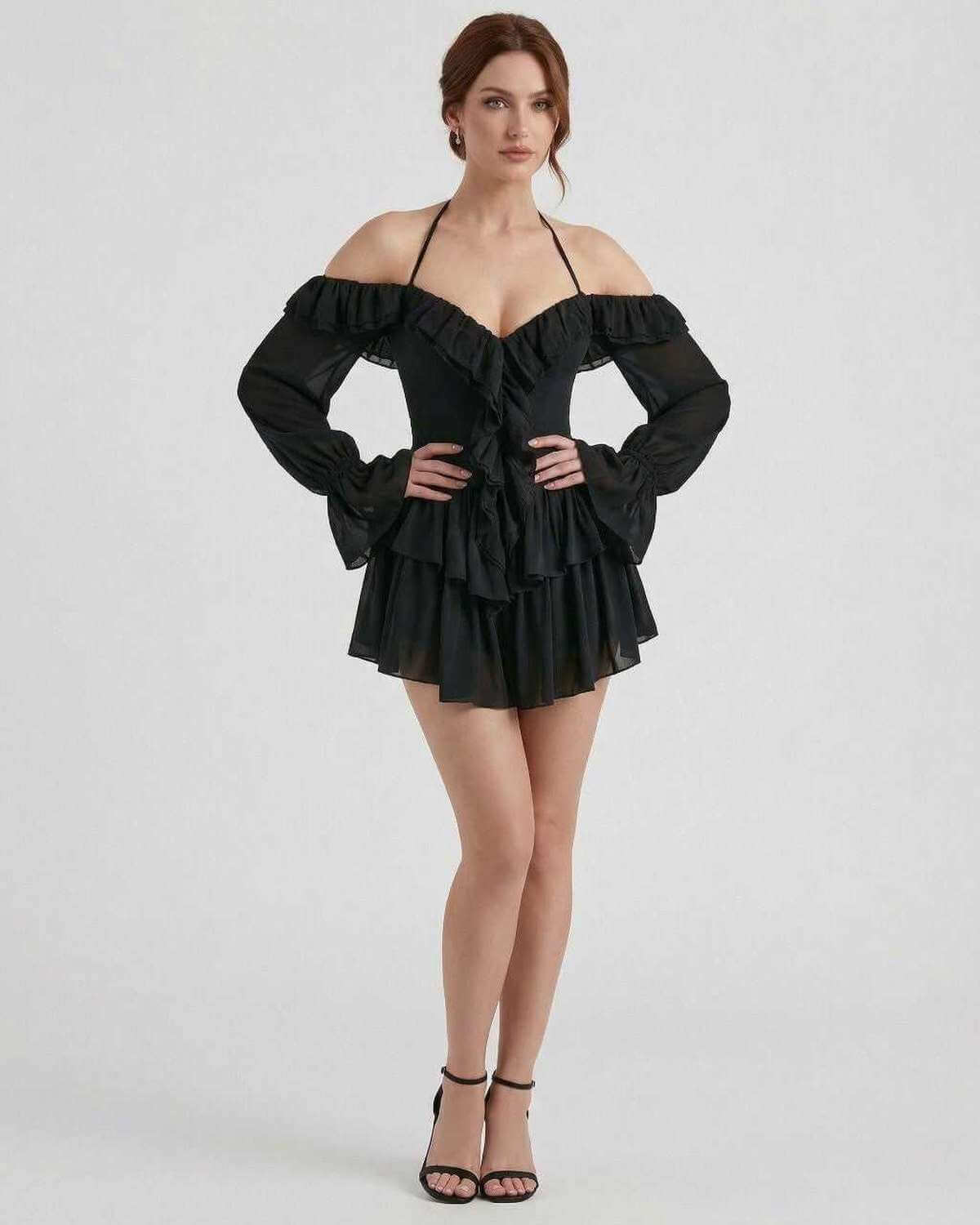 Ravelle Mini Dress by Lauven – Black halter ruffle mini dress with sheer sleeves and layered details.