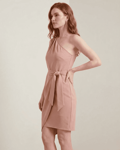 Lyra Mini Dress by SLIMONA, a one-shoulder satin bodycon dress with an asymmetrical hem in pink.
