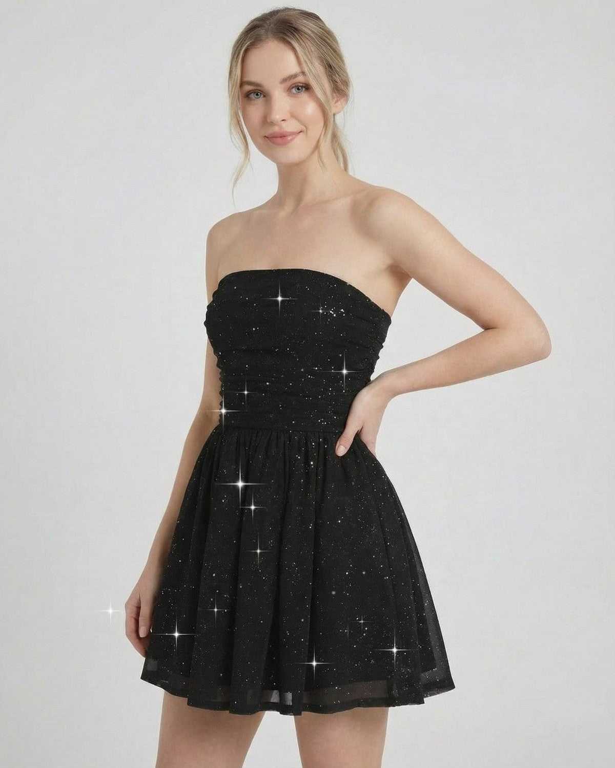 Lyra Mini Dress by SLIMONA, strapless black A-line dress with bow detail and subtle shimmer.