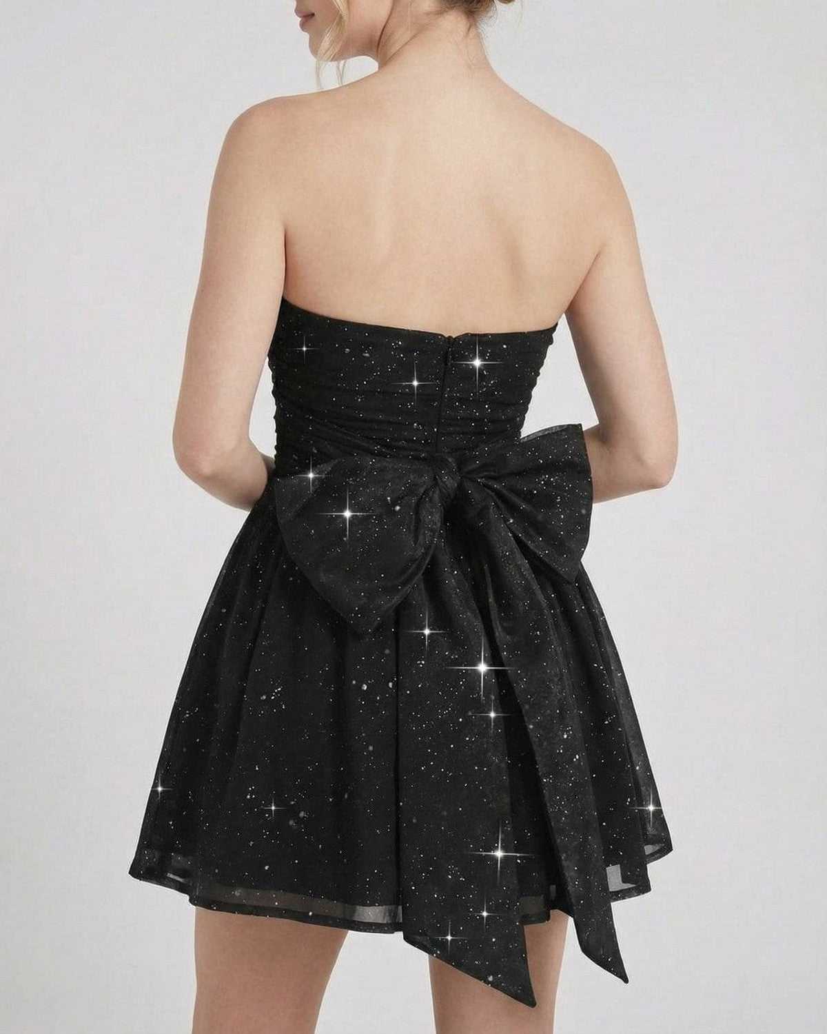 Back view of the SLIMONA Lyra Mini Dress with strapless design, bow detail, and subtle shimmer effect.