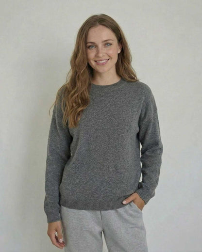 Lyra Pullover from SLIMONA, showcasing a soft wool knit sweater in a relaxed silhouette with a modern look.