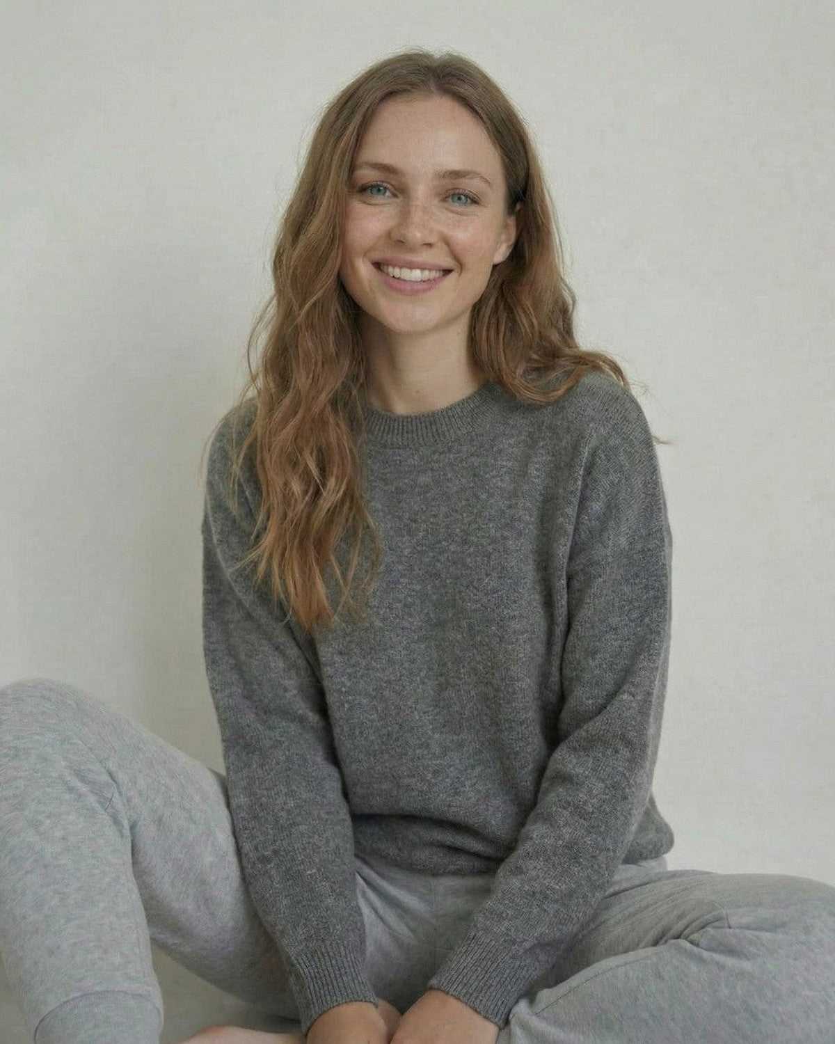 Model wearing the Lyra Pullover by SLIMONA, showcasing the soft wool knit in a relaxed silhouette.