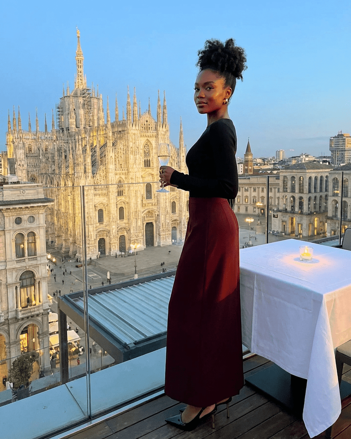 Merlot Maxi Skirt by SLIMONA worn with elegance against a scenic backdrop of Milan.