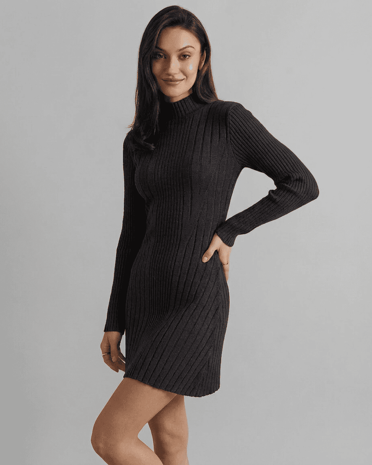 Model wearing the Milano Mini Dress by SLIMONA, showcasing its ribbed knit and mock neck design.