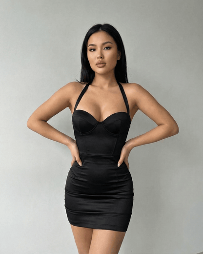 Model wearing Lauven Monaco Mini Dress – Black Satin Bodycon Halter Cocktail Mini Dress with sculpted cup detailing.