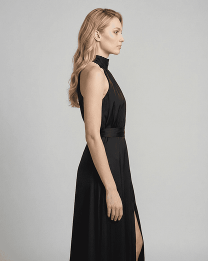 Noctis Maxi Dress by SLIMONA, showcasing a sleeveless turtleneck style with a side slit in elegant black.