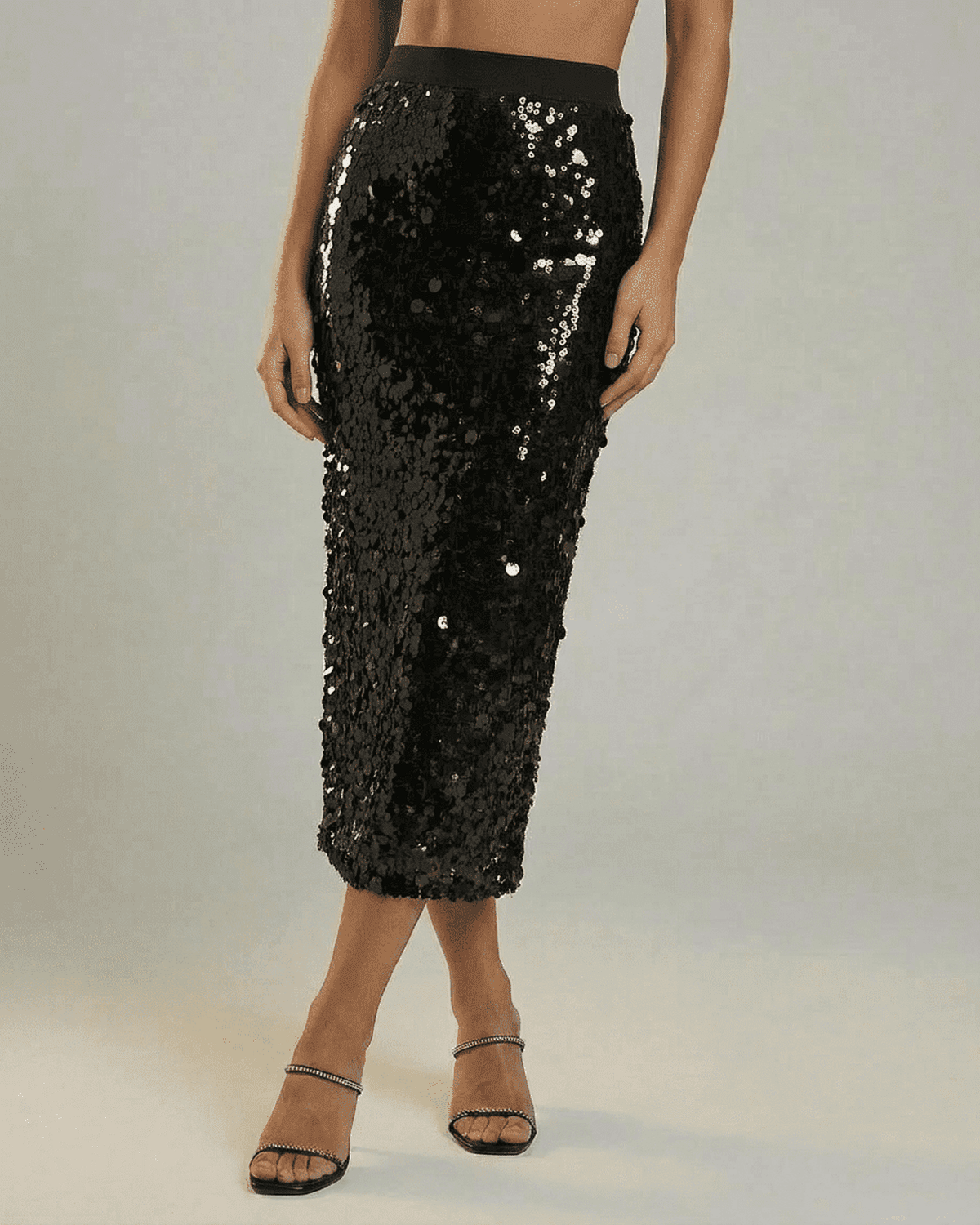 Noctura Midi Skirt by SLIMONA – Black sequin bodycon midi skirt for stylish evening wear.