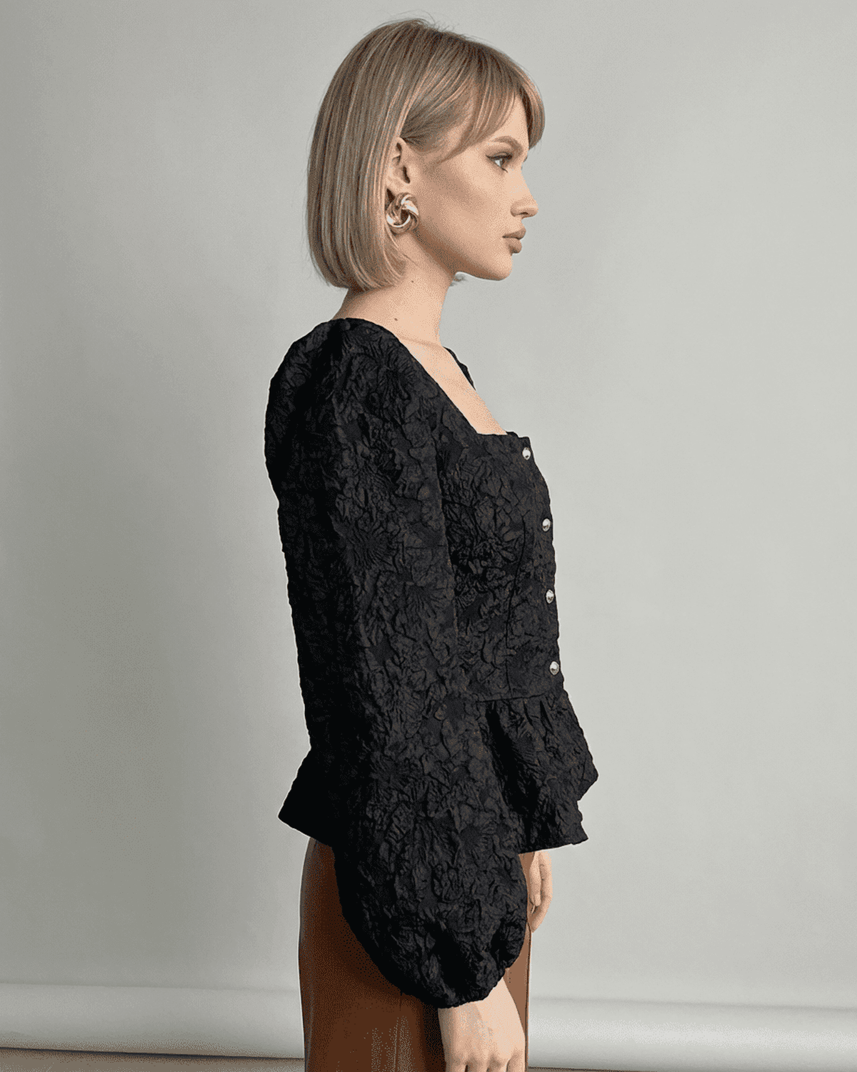 Noir Corset Top by SLIMONA, a jacquard square neck blouse with puff sleeves and tailored structure.