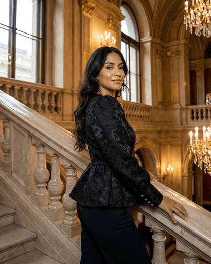 Noir Corset Top by SLIMONA, sophisticated jacquard top with puff sleeves, captured in an elegant setting.