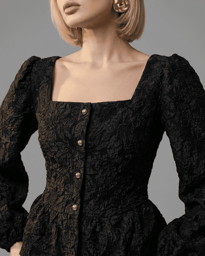 Noir Corset Top by SLIMONA featuring a jacquard square neck and puff sleeves, showcasing elegant design and craftsmanship.