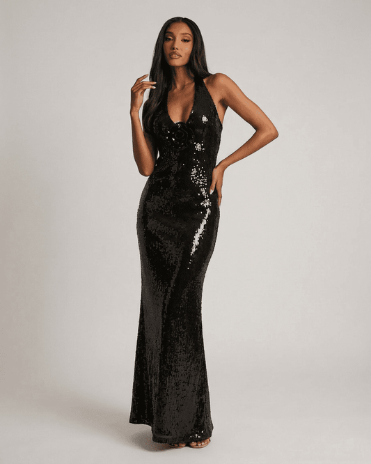 Noiré Maxi Dress by SLIMONA featuring a backless V-neck silhouette and floral sequin details, showcasing elegance.