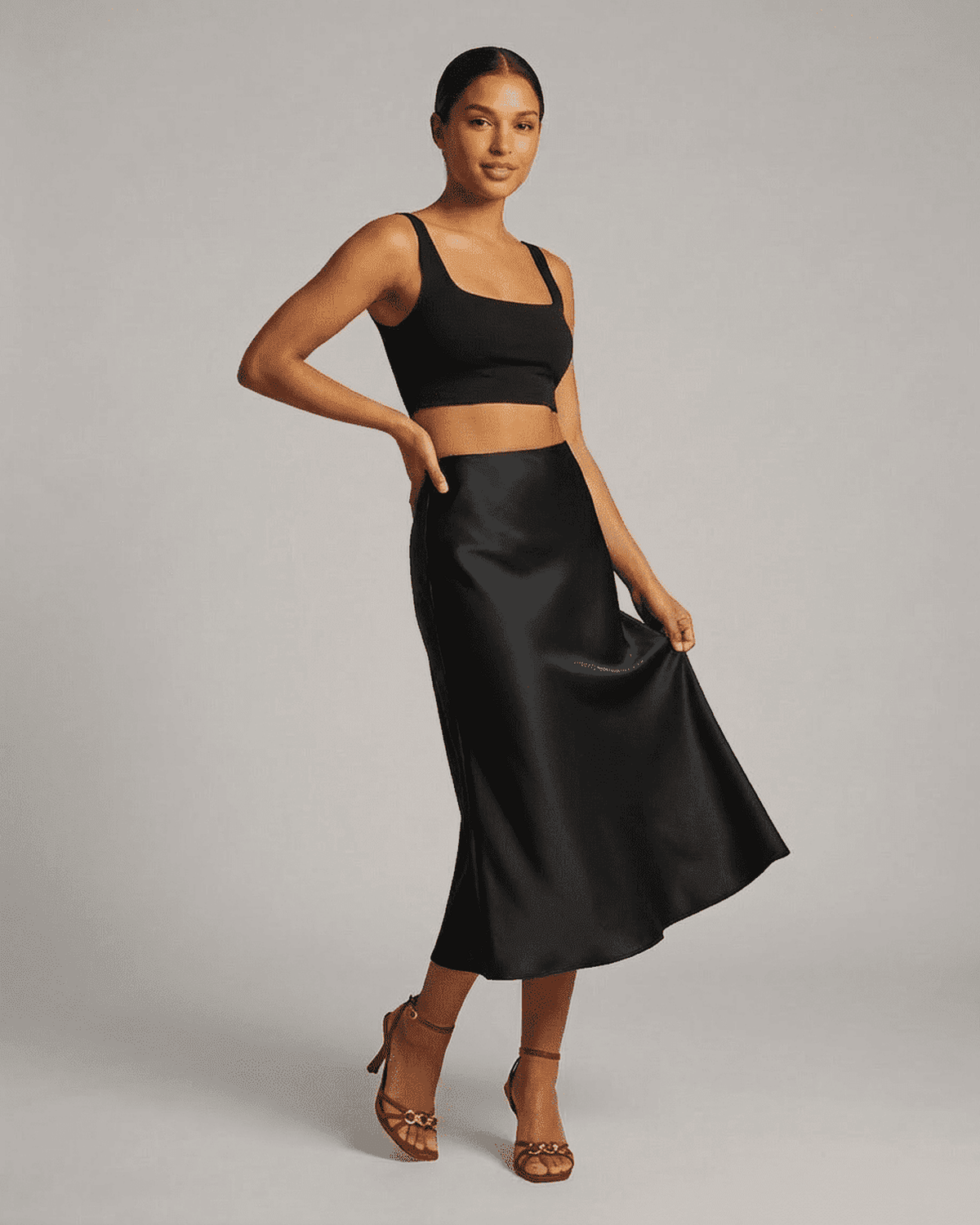 Noirelle Midi Skirt from SLIMONA – elegant satin mermaid skirt in classic black, perfect for any sophisticated outfit.