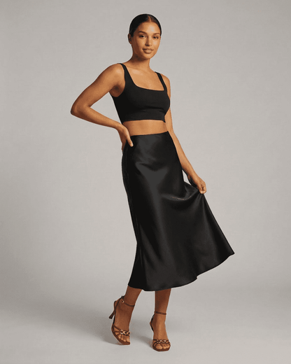 Noirelle Midi Skirt from SLIMONA – elegant satin mermaid skirt in classic black, perfect for any sophisticated outfit.