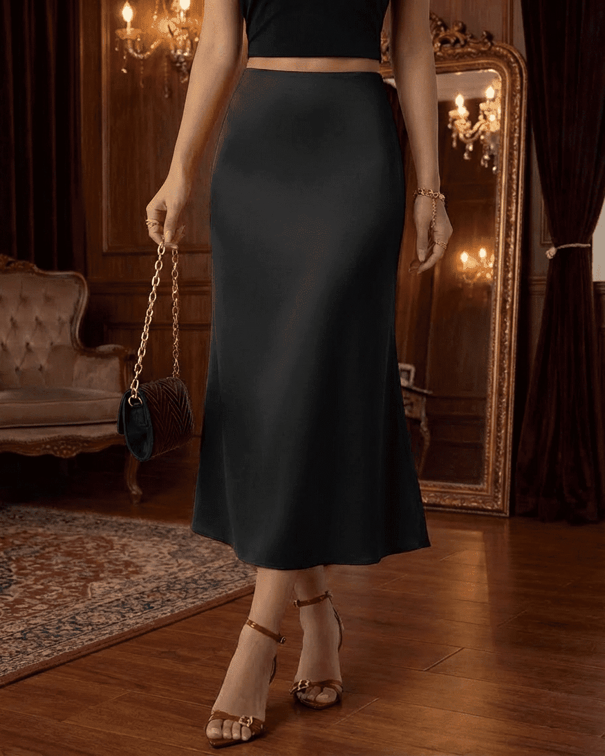 Noirelle Midi Skirt by SLIMONA in black, showcasing satin mermaid design and elegant silhouette.