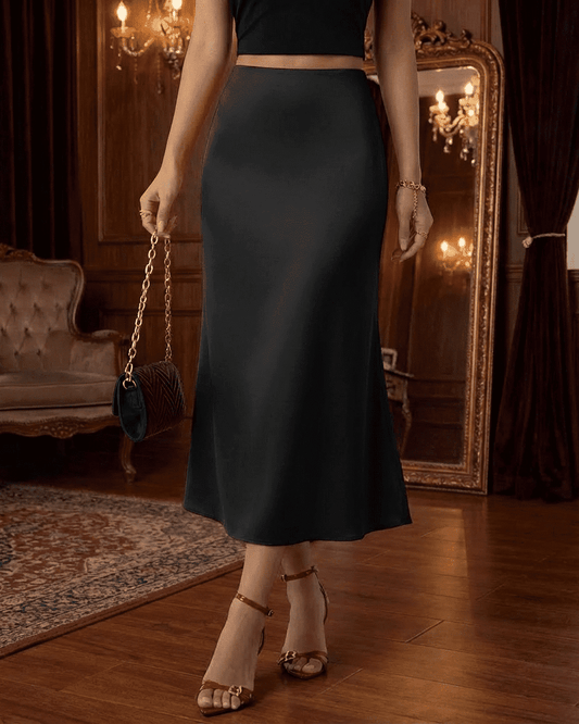 Noirelle Midi Skirt by SLIMONA in black, showcasing satin mermaid design and elegant silhouette.