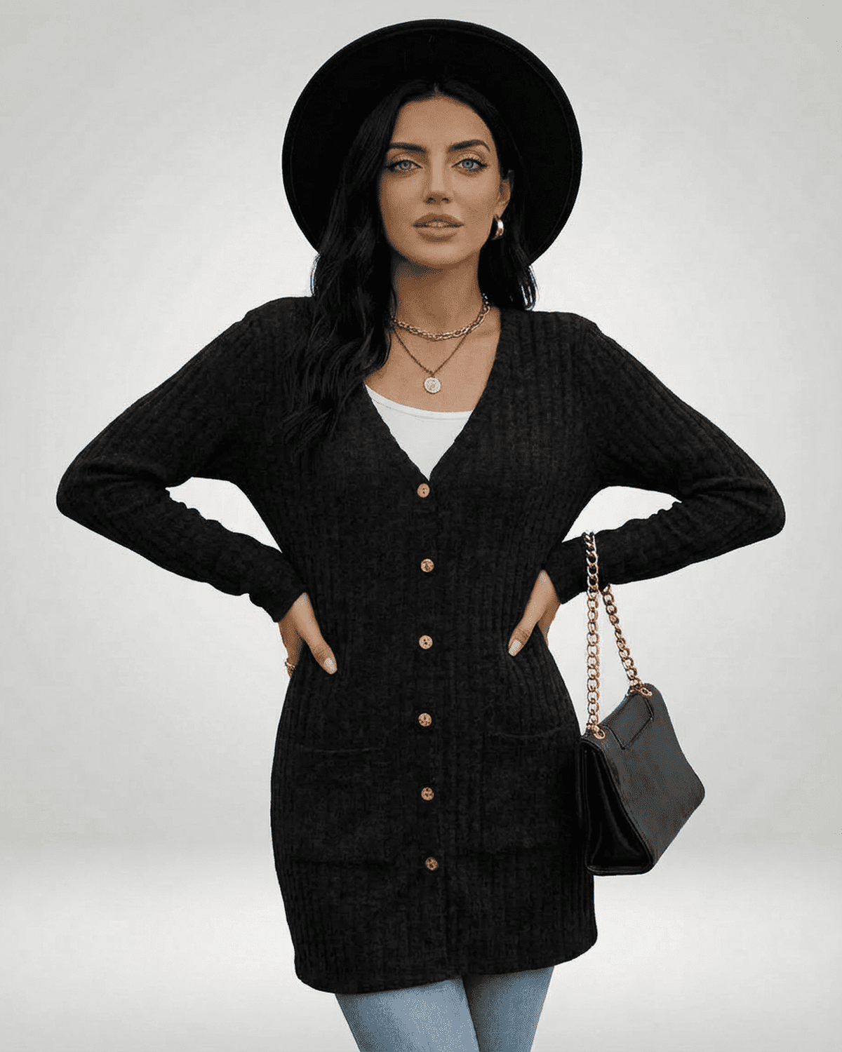 Model wearing a Nyx Cardigan by SLIMONA, showcasing a longline silhouette and classic V-neckline.