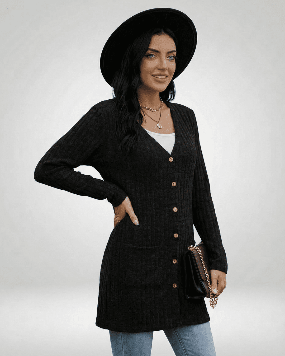 Chic woman modeling the Nyx Cardigan by SLIMONA, a longline button-front knitwear perfect for casual style.