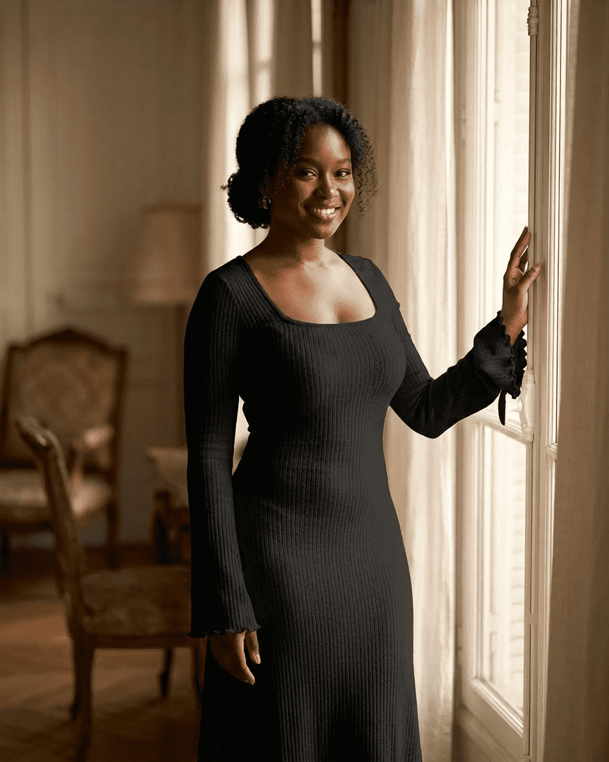 Woman wearing Nyx Maxi Dress by SLIMONA, featuring a ribbed knit, square neckline, and long sleeves.