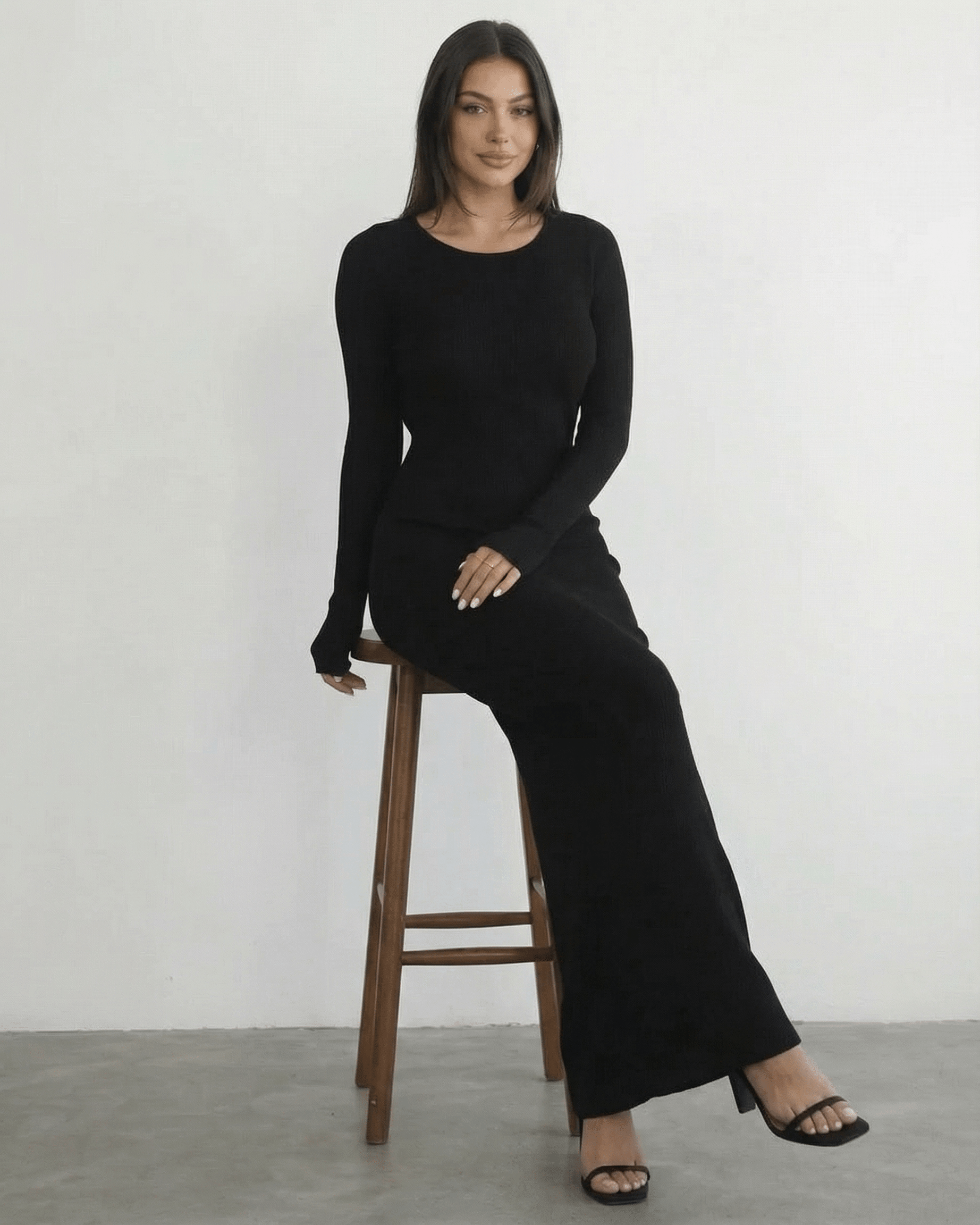 Nyx Maxi Dress by Lauven: Long sleeve black dress with open back, sleek silhouette, and ankle-length design.