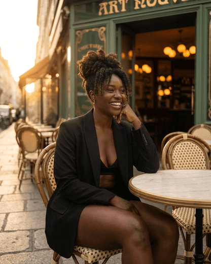 Obsidia Blazer by SLIMONA worn by a woman enjoying coffee at an outdoor café, showcasing modern chic style.