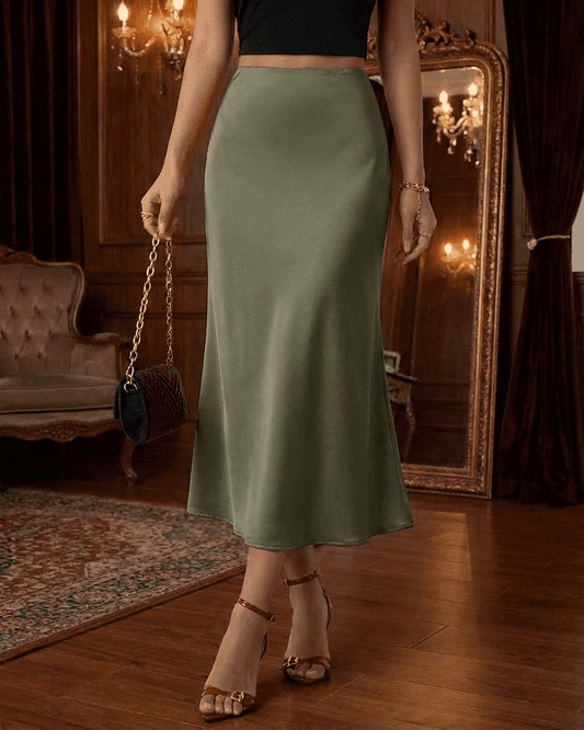 Olivia Midi Skirt by SLIMONA, olive green satin mermaid midi skirt creating an elegant silhouette.
