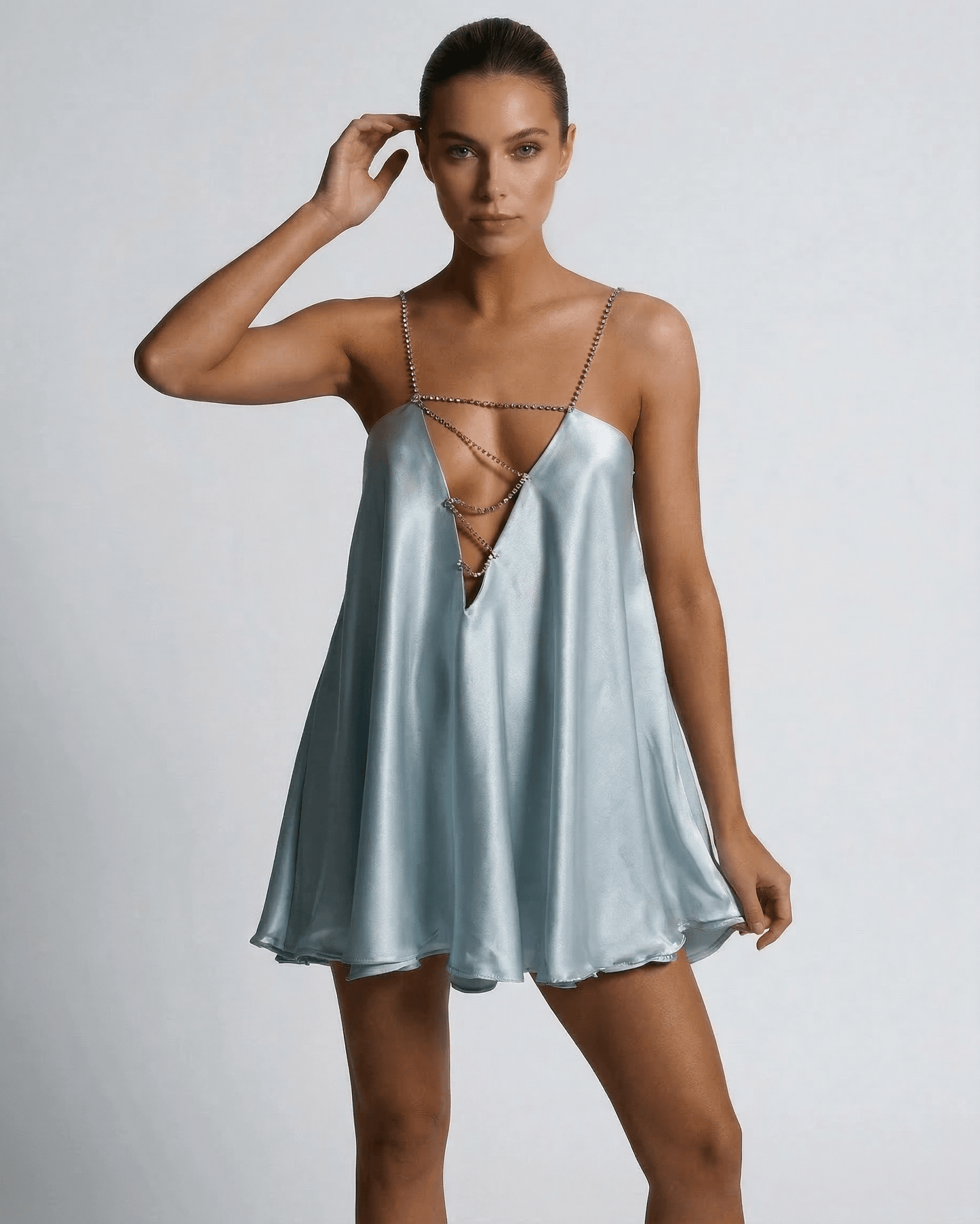 Celeste Mini Dress by Lauven in soft sky blue satin with rhinestone detailing, perfect for summer events.