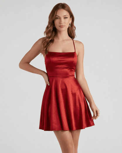 Ruby Satin Mini dress by Lauven, featuring a rich ruby red satin A-line silhouette with spaghetti straps.